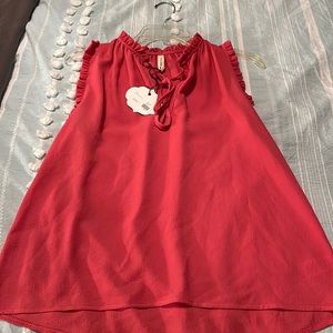Beautiful sleeveless ruffled edges. NWT